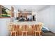 Kitchen with breakfast bar and wood cabinets at 13089 Alcott Pl, Broomfield, CO 80020