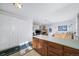 View of kitchen with breakfast bar and cabinets at 13089 Alcott Pl, Broomfield, CO 80020