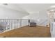 Spacious loft with a comfortable sitting area and a view to the level below at 431 High Plains St, Castle Rock, CO 80104