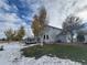 Two-story home with a large backyard and mature trees at 56805 E 33Rd Pl, Strasburg, CO 80136