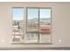 Bedroom with expansive windows offering scenic mountain and neighborhood views at 12983 W Ida Ave # 315, Littleton, CO 80127