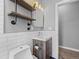 Clean bathroom with subway tile and industrial shelving at 319 Delaware St, Denver, CO 80223