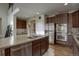 Modern kitchen with stainless steel appliances and an island at 16730 Race Ct, Thornton, CO 80602