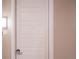 White front door with silver door handle at 12983 W Ida Ave # 321, Littleton, CO 80127