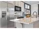 Modern kitchen with stainless steel appliances and granite countertops at 5442 N Tower Rd, Denver, CO 80249