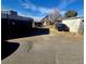 Backyard area with gravel, a car, and detached structure at 3742 Brighton Blvd, Denver, CO 80216