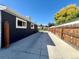 Side yard with concrete driveway and wooden fence at 815 S Field St, Lakewood, CO 80226