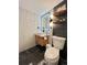 Modern bathroom with floating vanity, LED mirror, and walk-in shower at 815 S Field St, Lakewood, CO 80226