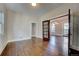 Sunlit dining room with hardwood floors and French doors to another room at 3028 Meade St, Denver, CO 80211