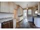 Modern kitchen with stainless steel appliances and granite countertops at 3028 Meade St, Denver, CO 80211