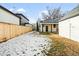 Large backyard with a wooden fence, providing privacy and ample space at 1452 S Vine St, Denver, CO 80210