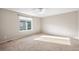 Well-lit bedroom with carpet and a large window at 10706 Butte Dr, Longmont, CO 80504