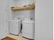 Laundry room with washer, dryer, and additional shelving at 3574 Corsica Way, Castle Rock, CO 80109