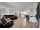 Open concept living area with hardwood floors and a view of the kitchen at 3574 Corsica Way, Castle Rock, CO 80109
