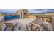 Relaxing rooftop deck featuring a table, chairs, and stunning city views at 3574 Corsica Way, Castle Rock, CO 80109