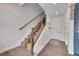Modern staircase with wood and metal accents, and unique runner at 3574 Corsica Way, Castle Rock, CO 80109