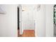 Bright hallway with built-in storage and hardwood floors at 1585 N Fairfax St, Denver, CO 80220