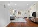 Living room features hardwood floors, a comfy couch, and plenty of natural light at 1585 N Fairfax St, Denver, CO 80220