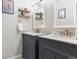 Elegant bathroom with dual vanities and marble countertops at 10360 W Jewell Ave # D, Lakewood, CO 80232