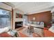 Cozy living room featuring a fireplace, comfortable seating, and hardwood floors at 1333 S Eudora St, Denver, CO 80222