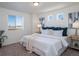 Spacious main bedroom with plush bed and ample natural light at 45036 Sunflower Ln, Bennett, CO 80102