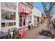 Charming local businesses, including ice cream shop and restaurant, line a walkable street at 1381 Sunrise Dr, Erie, CO 80516