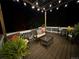 Relaxing nighttime deck with pergola, seating, and string lights at 647 Briar Haven Dr, Castle Pines, CO 80108