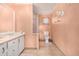 Clean bathroom with a shower/tub combo, toilet, and double vanity at 501 Zante Way, Lochbuie, CO 80603