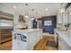 Bright kitchen with stainless steel appliances and white cabinetry at 9650 Poundstone Pl, Greenwood Village, CO 80111