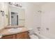 Clean bathroom with a tub, shower, and updated vanity at 1280 Sable Blvd, Aurora, CO 80011