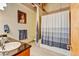 Bathroom with shower/tub, tiled floor and granite countertop at 1800 Lawrence St # 206, Denver, CO 80202