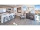 Open concept kitchen with island, stainless steel appliances, and breakfast area at 45040 Sunflower Ln, Bennett, CO 80102