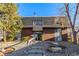 Brick building exterior with landscaping and stairs leading to the entrance at 100 E Highline Cir # 306, Centennial, CO 80122