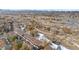 Aerial view of townhouses near a park and a river with mountain views at 8791 W Cornell Ave # 7, Lakewood, CO 80227