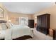 Main bedroom with king-size bed, large closet, and access to the bathroom at 6520 Virgil Way, Arvada, CO 80007