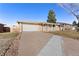 Ranch style home with attached garage and driveway at 4321 W Quinn Pl, Denver, CO 80236