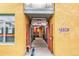 Inviting building entrance with colorful decor and access to a courtyard at 910 Santa Fe Dr # 19, Denver, CO 80204