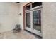 Private patio with seating area and French doors at 910 Santa Fe Dr # 19, Denver, CO 80204