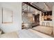 Main bedroom with window and view into living room at 910 Santa Fe Dr # 19, Denver, CO 80204