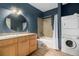 Bathroom with walk-in shower, mosaic tile, and modern vanity at 910 Santa Fe Dr # 19, Denver, CO 80204