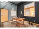 Small office space with wood table and window seat at 910 Santa Fe Dr # 19, Denver, CO 80204