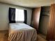 Bright bedroom with a double bed and built-in closet at 13261 E Asbury Dr # 202, Aurora, CO 80014