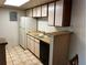Clean kitchen with white appliances and wood cabinets at 13261 E Asbury Dr # 202, Aurora, CO 80014