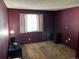 Simple bedroom with carpeted floor, window, and a desk at 13261 E Asbury Dr # 202, Aurora, CO 80014
