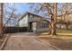 Two-story house with a sunroom and a fenced yard at 115 Johnson St, Frederick, CO 80530