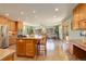 Updated kitchen boasts a large island and stainless steel appliances at 9350 Grandview Ave, Arvada, CO 80002