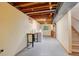 Unfinished basement with laundry hookups and ample storage at 9350 Grandview Ave, Arvada, CO 80002