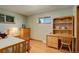 Bright bedroom with wood floors, built-in desk, and ample closet space at 9350 Grandview Ave, Arvada, CO 80002
