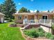 Landscaped backyard with deck and garden at 9350 Grandview Ave, Arvada, CO 80002