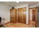 Bright home office with hardwood floors and built-in cabinet at 9350 Grandview Ave, Arvada, CO 80002